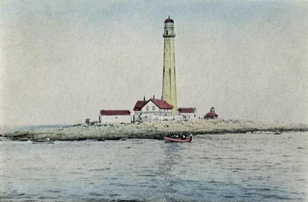 A 1911 postcard picture of the Boon Island Lighthouse, a boat and the surrounding water.